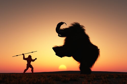 Homem caçando mamute