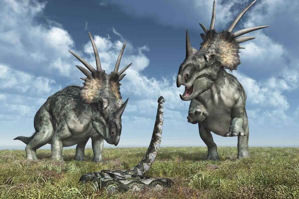 Uma cobra luta contra dinossauros.